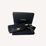 Chanel Boy leather zip-around wallet with quilted design and iconic Boy clasp