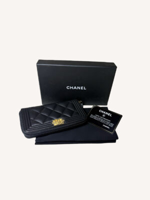 Chanel Boy leather zip-around wallet with quilted design and iconic Boy clasp