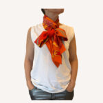 Hermès Amazon Festival scarf styled as a neck accessory