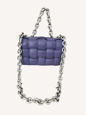 Close-up of Bottega Veneta purple leather Cassette Bag with silver chain handle
