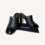 Chanel black quilted leather mules with patent cap toe and CC logo