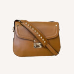 Designer Valentino saddle shoulder bag with signature Rockstud embellishments