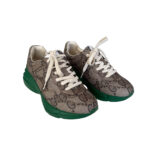 Iconic Gucci Rhyton leather sneakers with chunky sole and eye-catching logo print