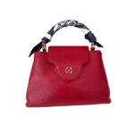 Hermès Spring Springs Twilly silk scarf in vibrant colorway with animated horse illustrations, designer neck accessory