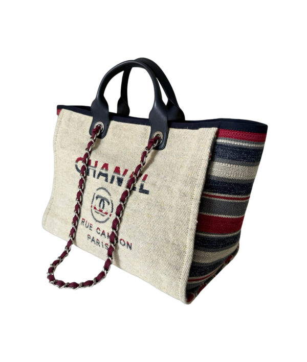 Chanel large Deauville Tote in textured canvas featuring dual straps and iconic branding detail