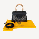 Goyard Mini Saigon Souple handbag in Goyardine canvas with leather trim and wood handle, luxury structured mini bag