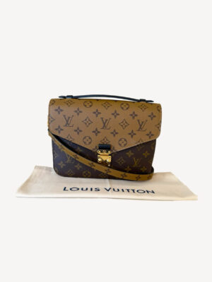 Louis Vuitton Pochette Métis Reverse in monogram reverse canvas with gold S-lock and top handle.