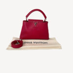 Louis Vuitton Capucines BB handbag in red Taurillon leather with top handle and silver-tone hardware