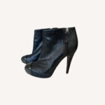 Chanel leather ankle boots with black cap toe and interlocking CC logo