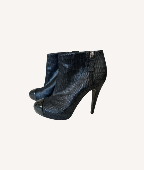 Chanel leather ankle boots with black cap toe and interlocking CC logo