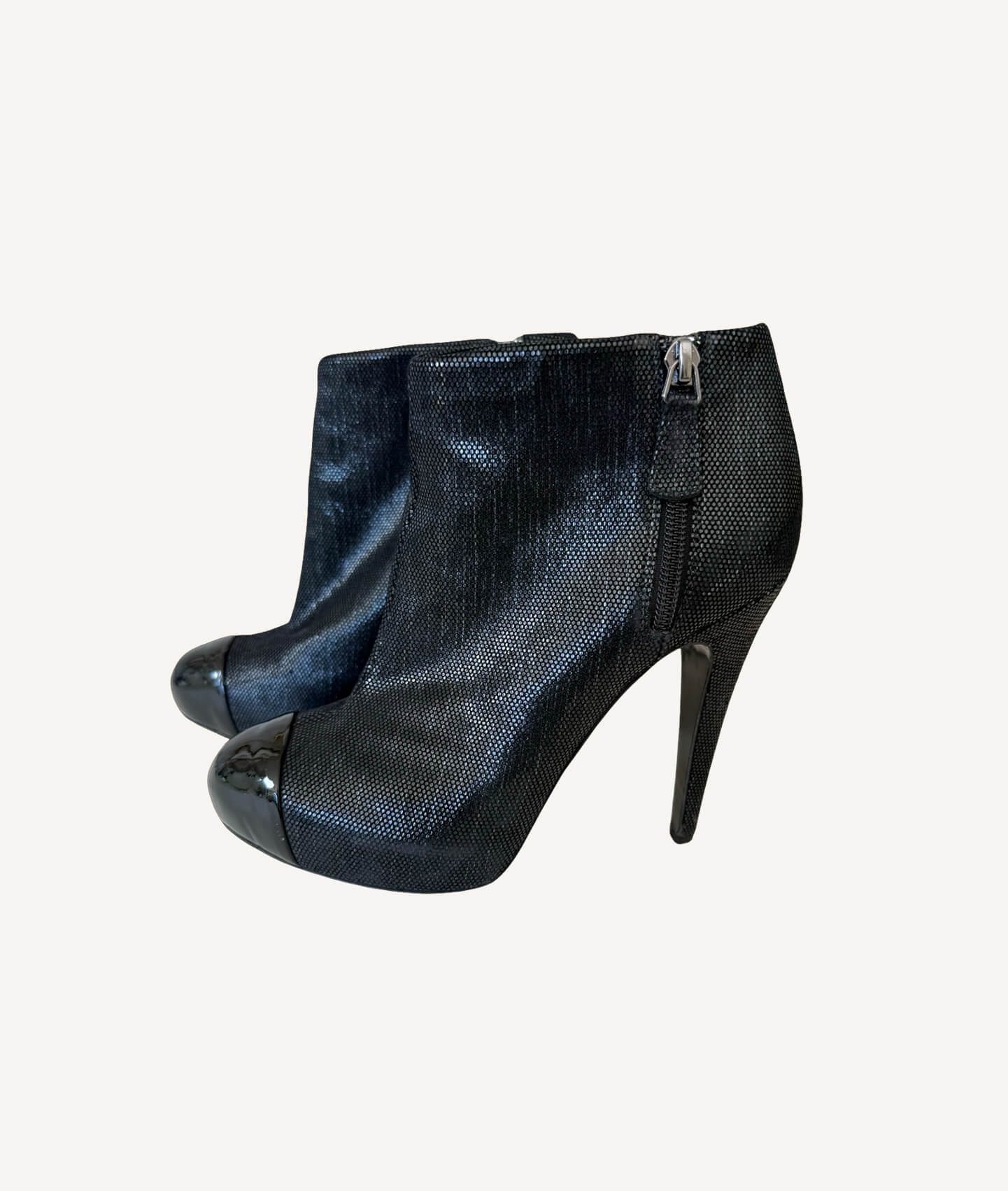 Chanel leather ankle boots with black cap toe and interlocking CC logo
