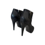 Chanel leather ankle boots with black cap toe and interlocking CC logo