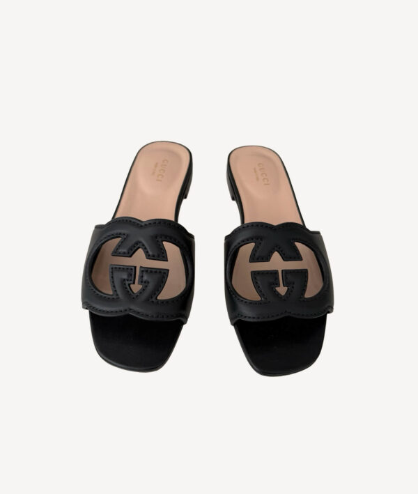 Black Gucci leather sandals featuring interlocking G logo and block heel