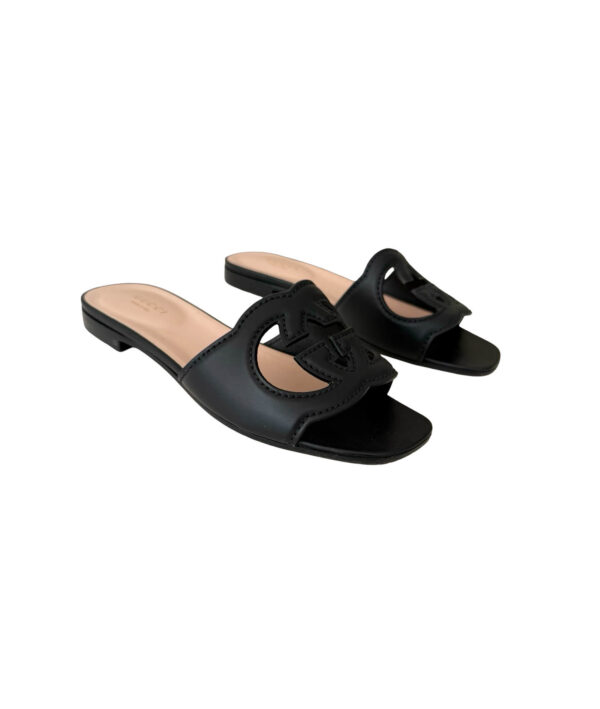 Black Gucci leather sandals featuring interlocking G logo and block heel