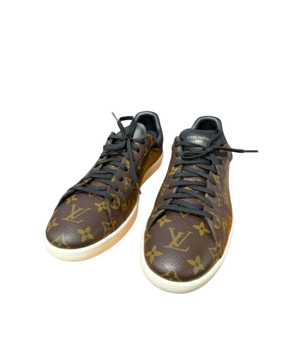 Close-up of Louis Vuitton Luxembourg Trainers with embossed monogram design