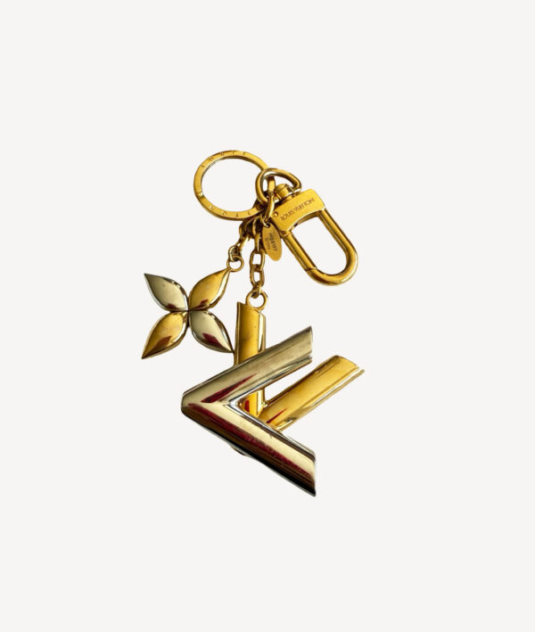 Louis Vuitton Twist bag charm and key holder in signature LV design