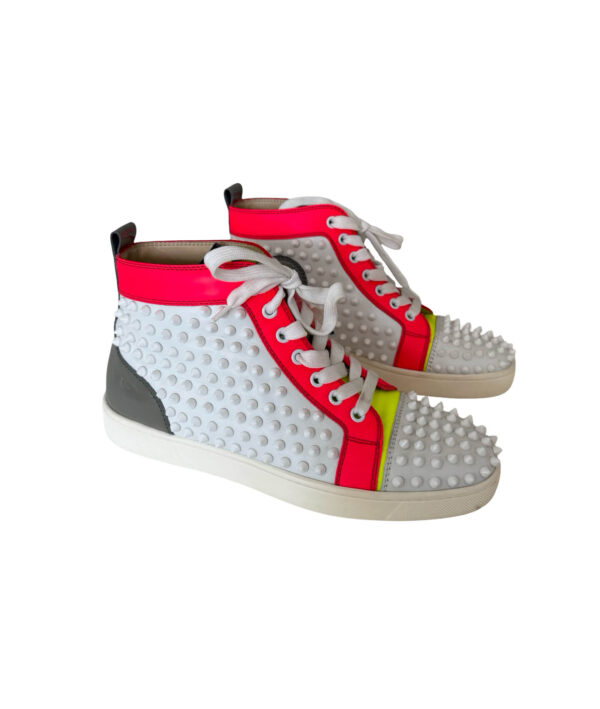 Luxury white leather Louis Spikes high-top sneakers by Christian Louboutin with iconic red bottoms and studded detailing.
