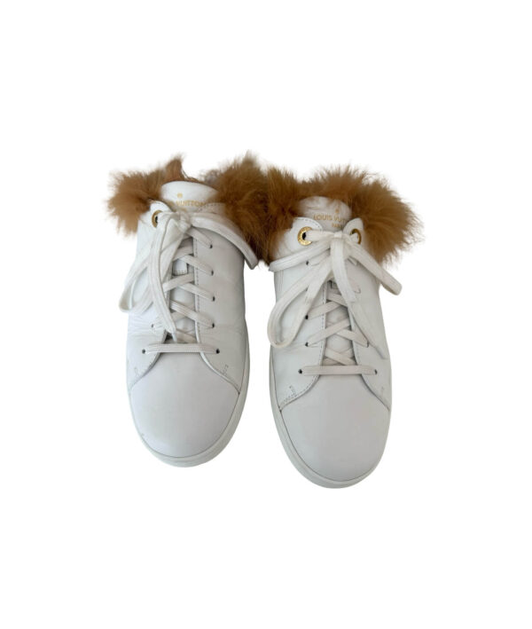 Louis Vuitton Charlie white trainers with beige shearling collar and white rubber sole — authentic designer footwear.