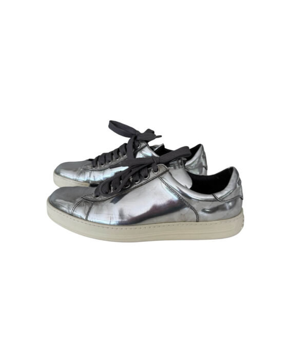 Luxury Tom Ford reflective silver leather sneakers featuring lace-up design and casual silhouette.