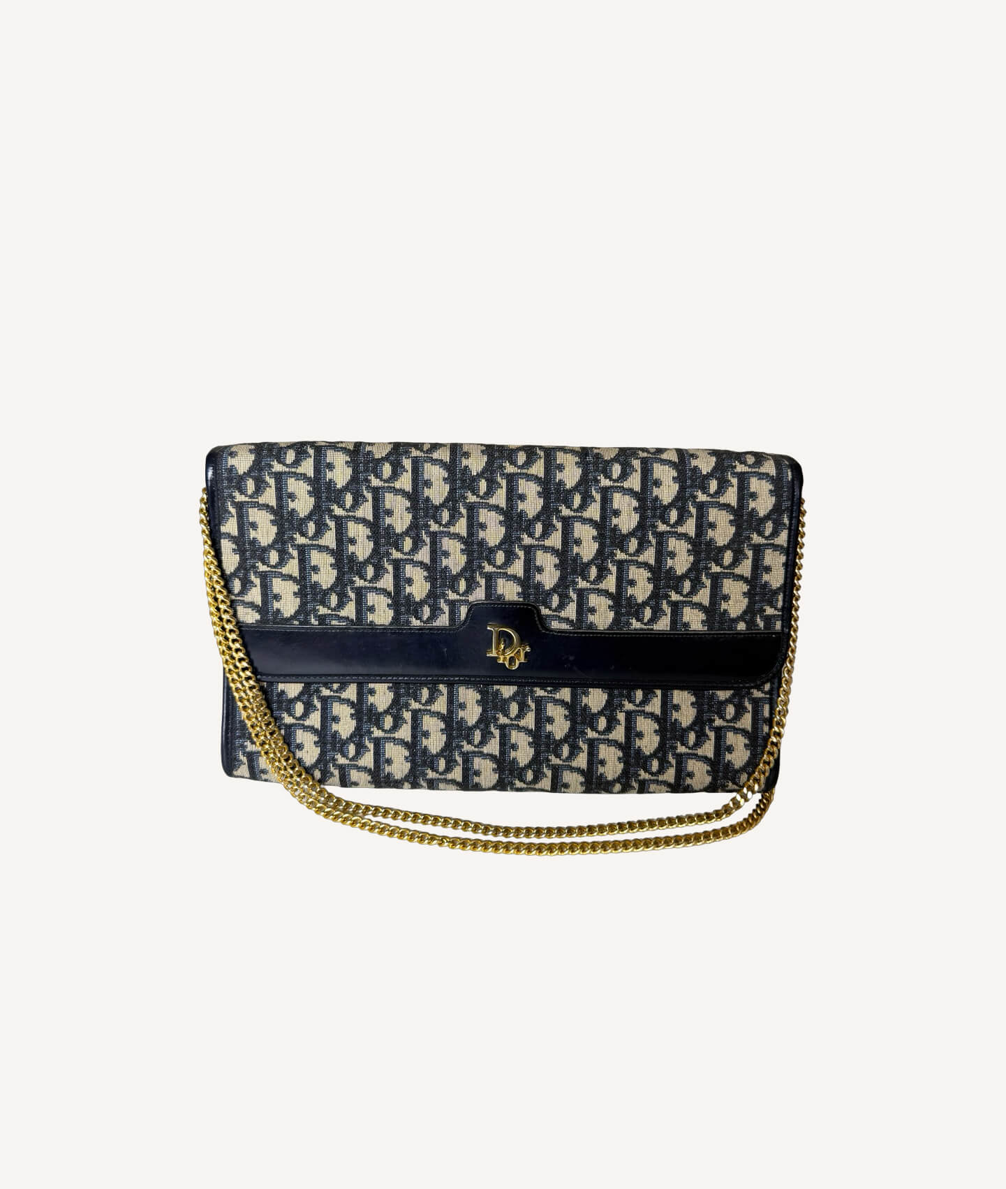 Vintage Christian Dior Diorissimo Trotter chain clutch in navy monogram canvas with gold CD logo and chain strap.