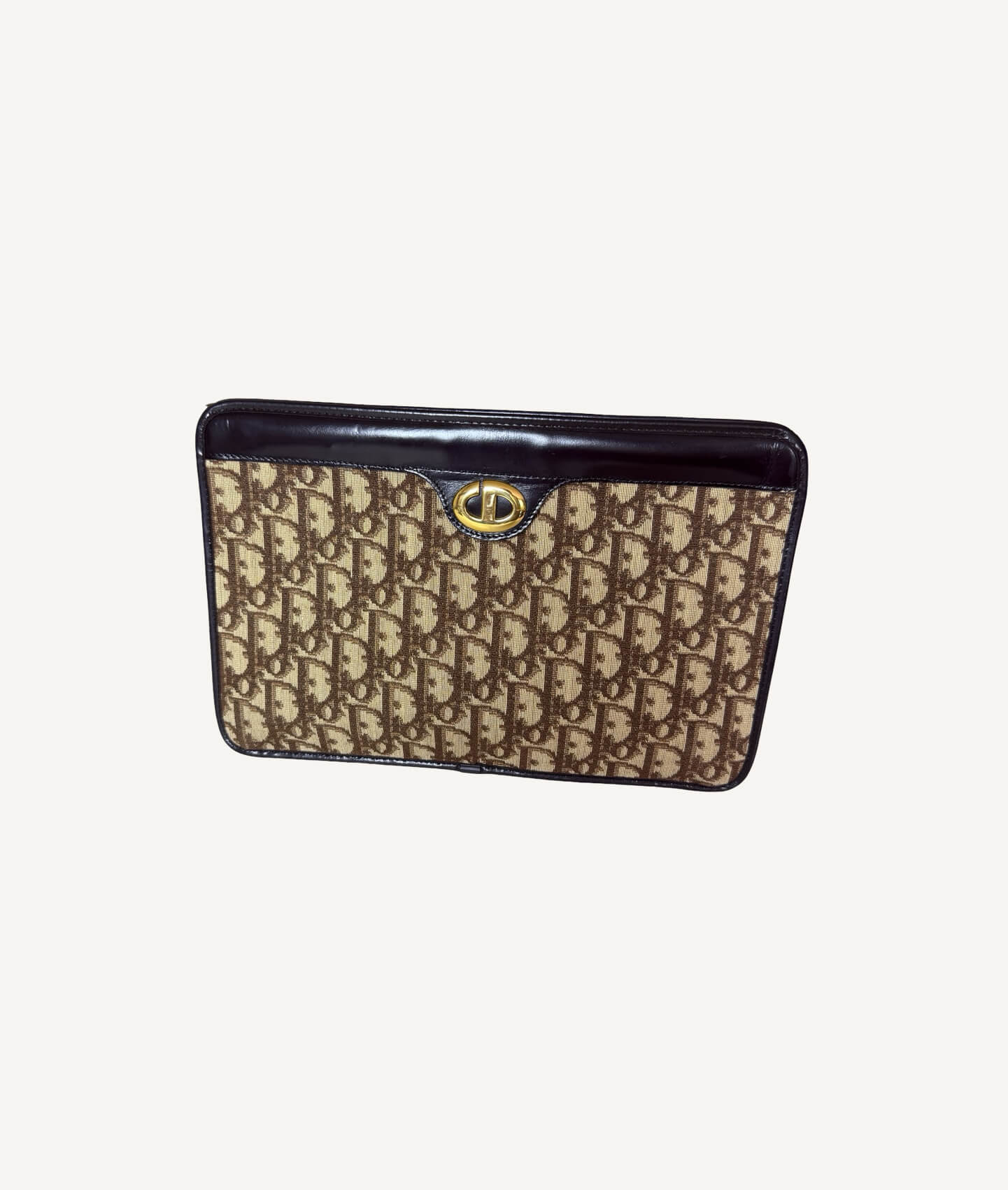 Vintage Christian Dior Trotter clutch in beige monogram canvas with brown leather trim and gold CD clasp.